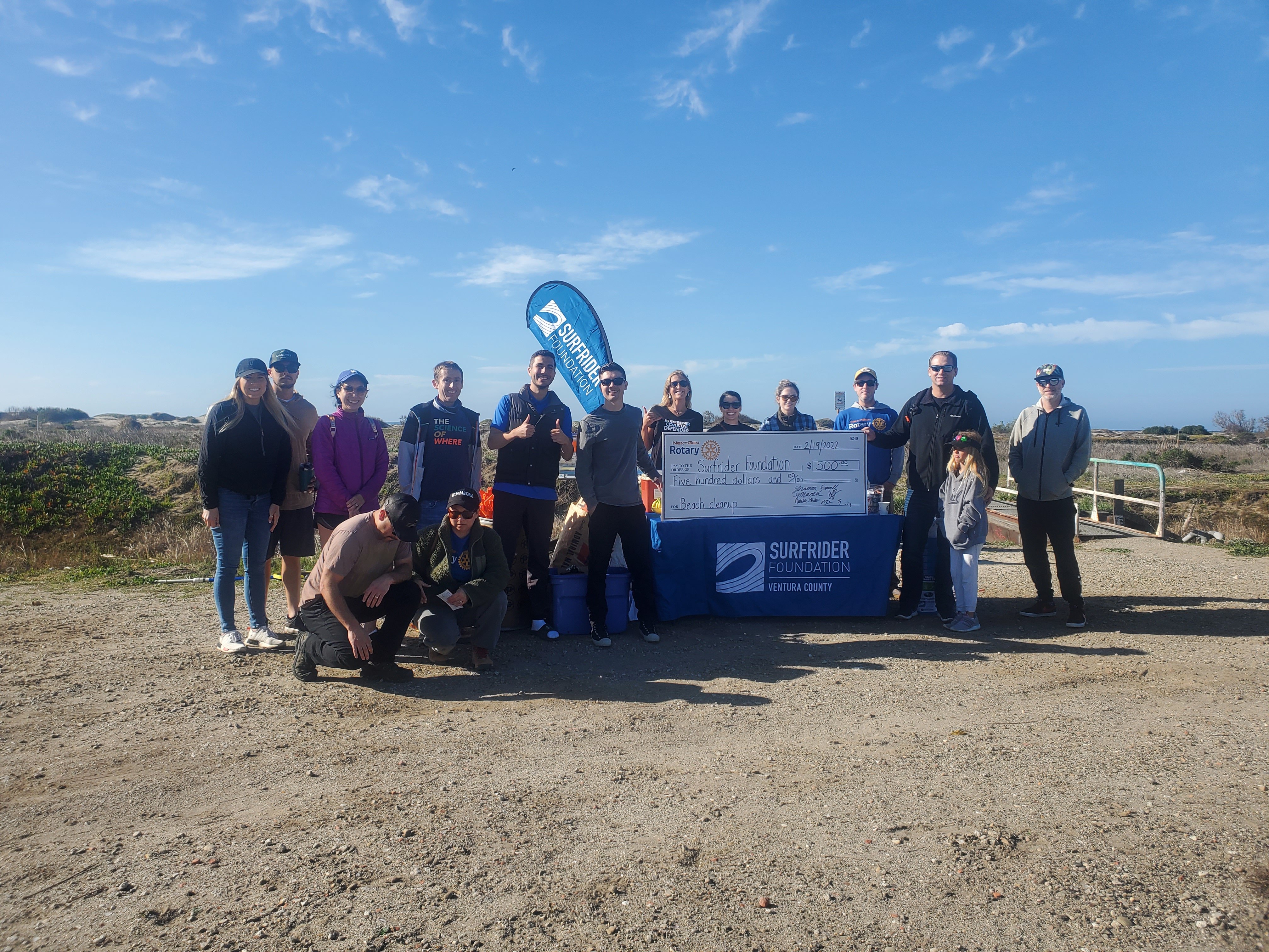 Volunteers posing in front of the Ormond Lagoon. 