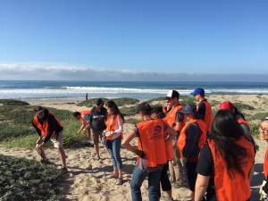 Dave Hubbard educating volunteers, who were showing off shiny new Surfrider vests!