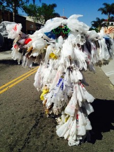 Bag Monster, the personification of 500 single-use grocery bags a year, walks menacingly toward the camera