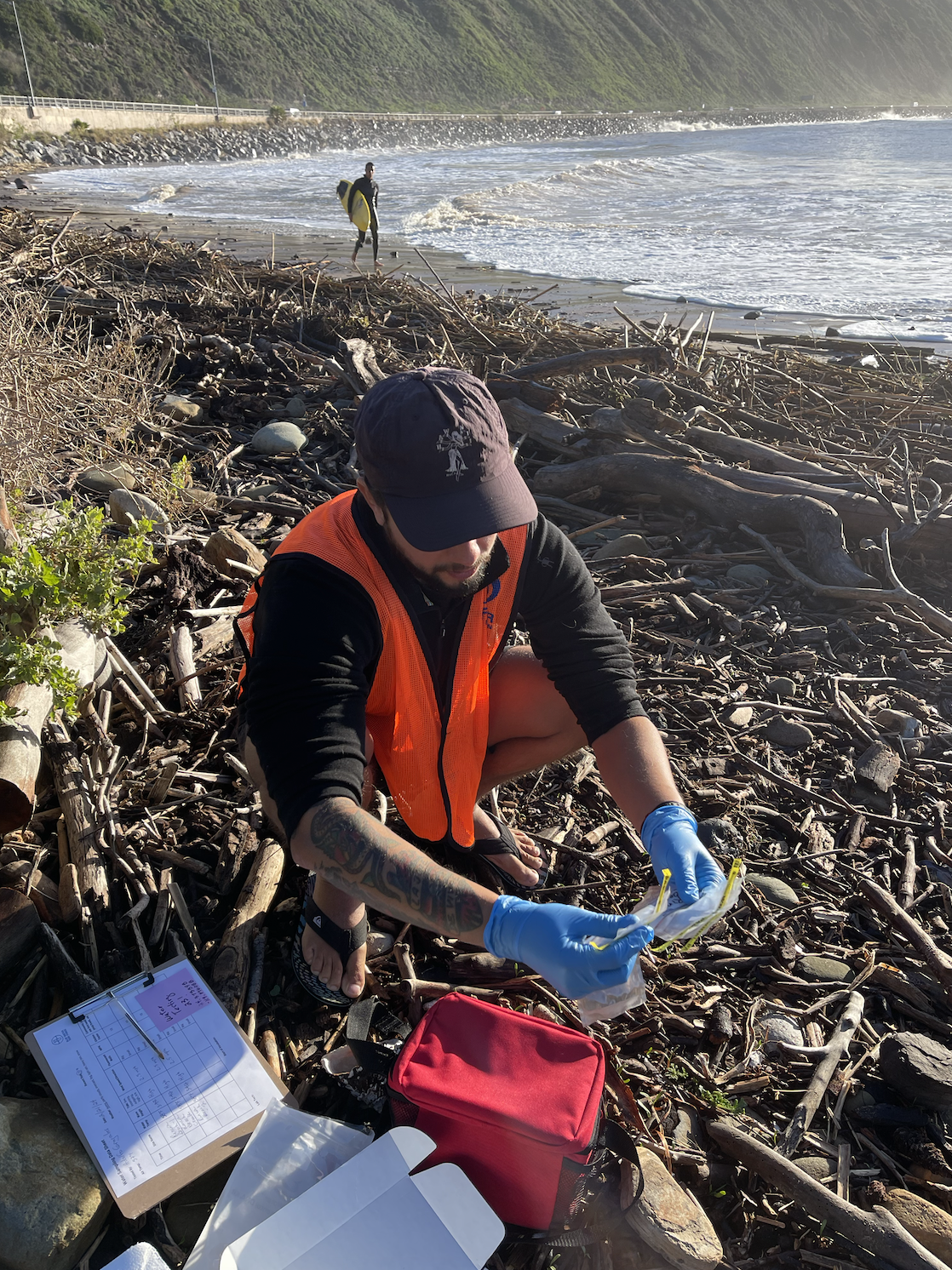 Ventura County BWTF Volunteer, Adolfo Grajales, collecting water samples to be tested for enterococcus bacteria at Rincon Point. 