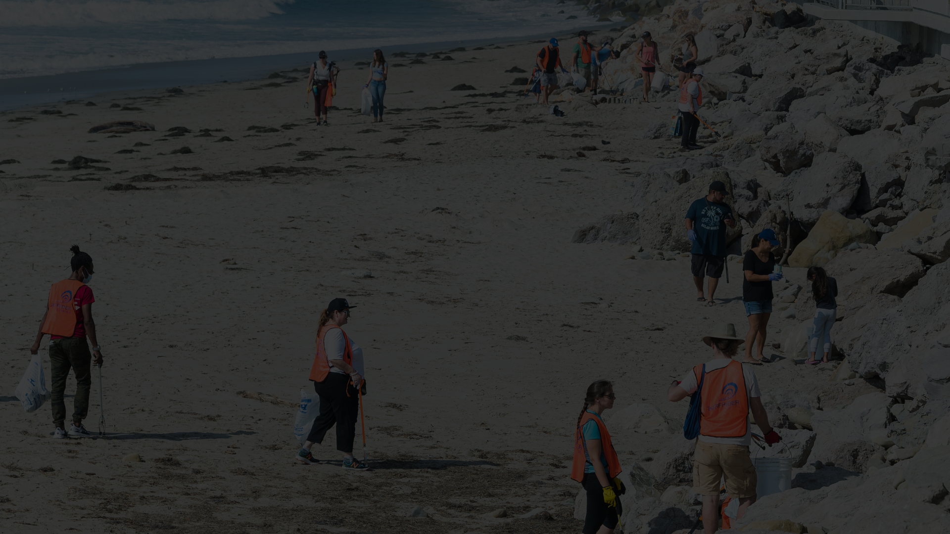 Volunteers picking up trash near the Ventura Promenade.